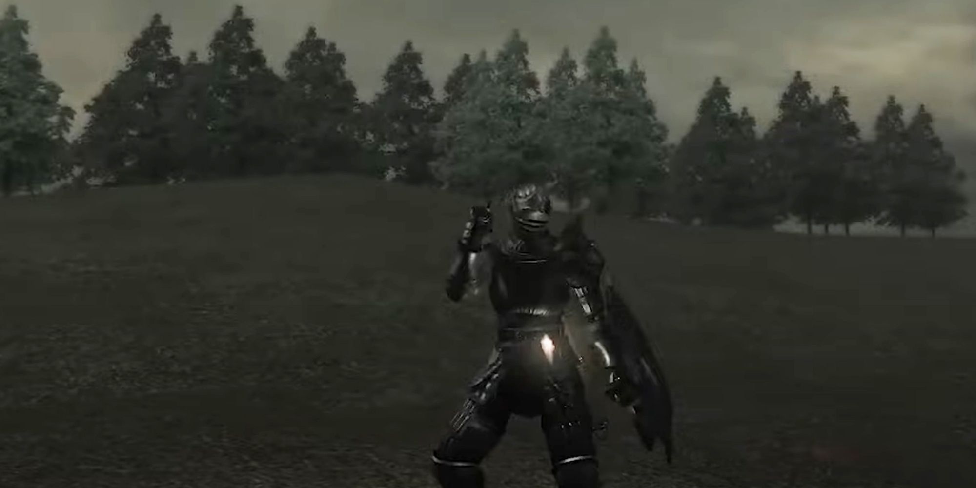 Demons Souls knight stood in an empty field in front of a forest