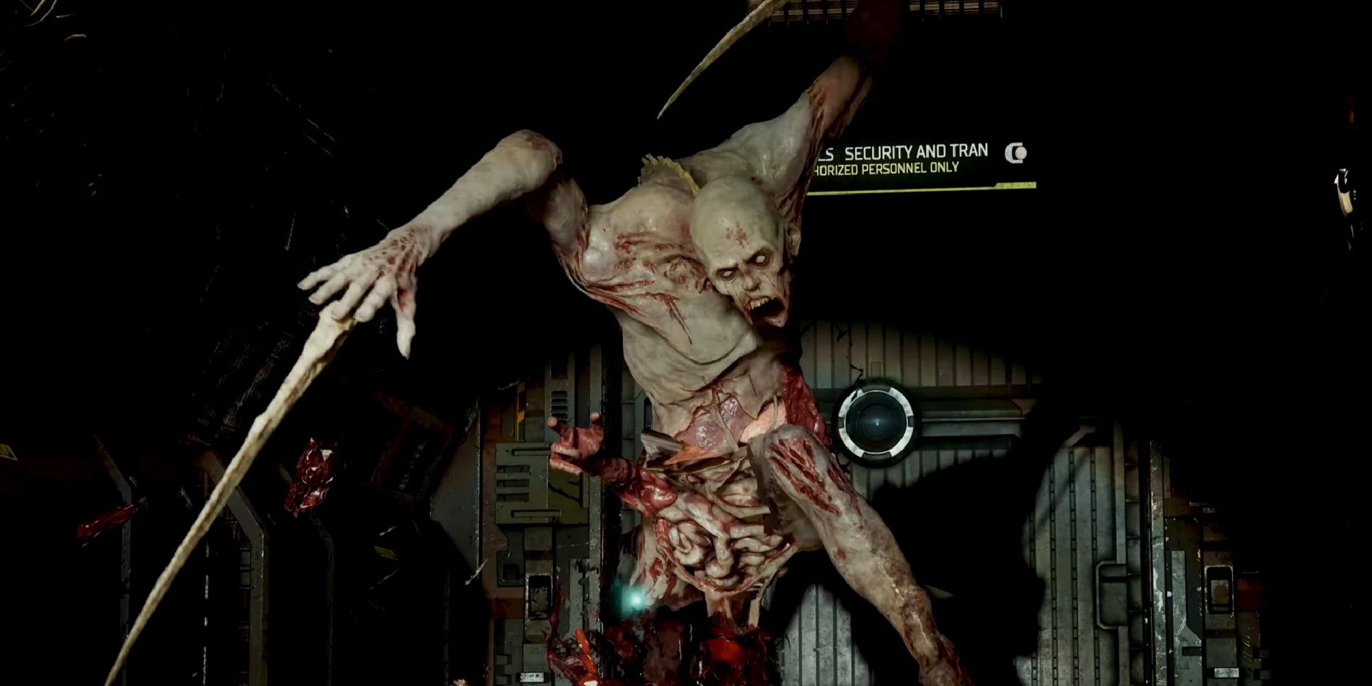 A Necromorph lunging towards camera with blood and guts showing