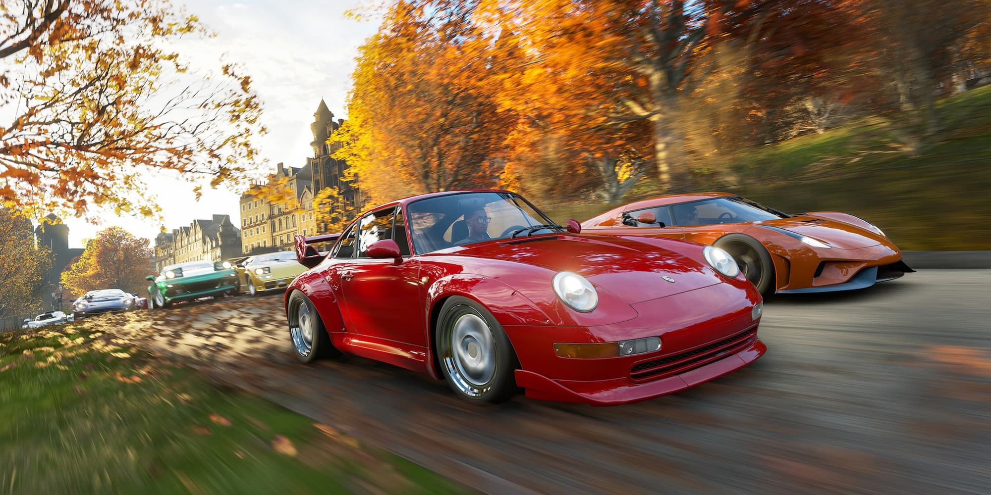 Red and orange cars lead a race between several vehicles, with leaves blowing behind them in Forza Horizon 4.