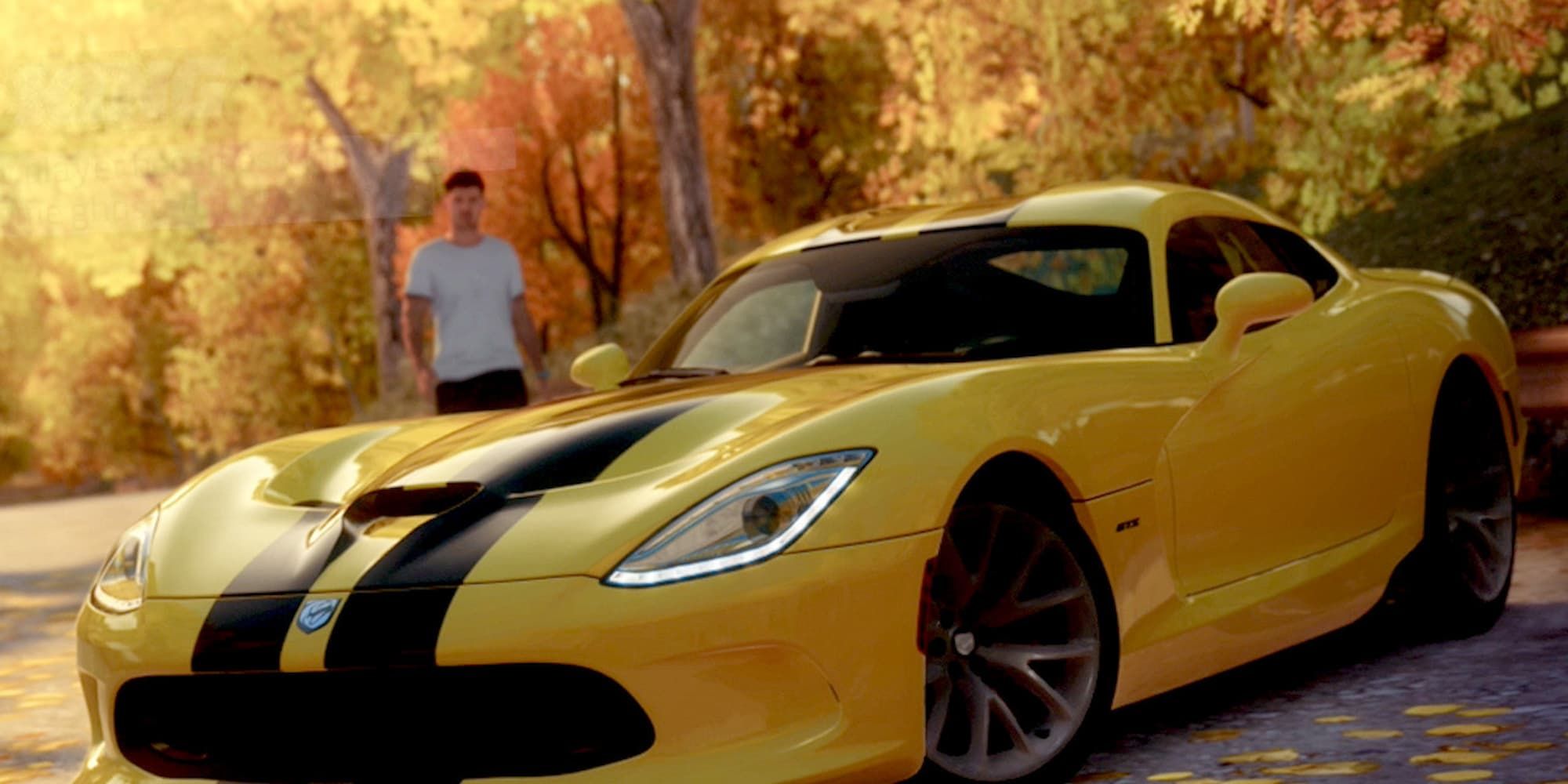 A man approaches a yellow car with two black stripes going down the middle in Forza Horizon.