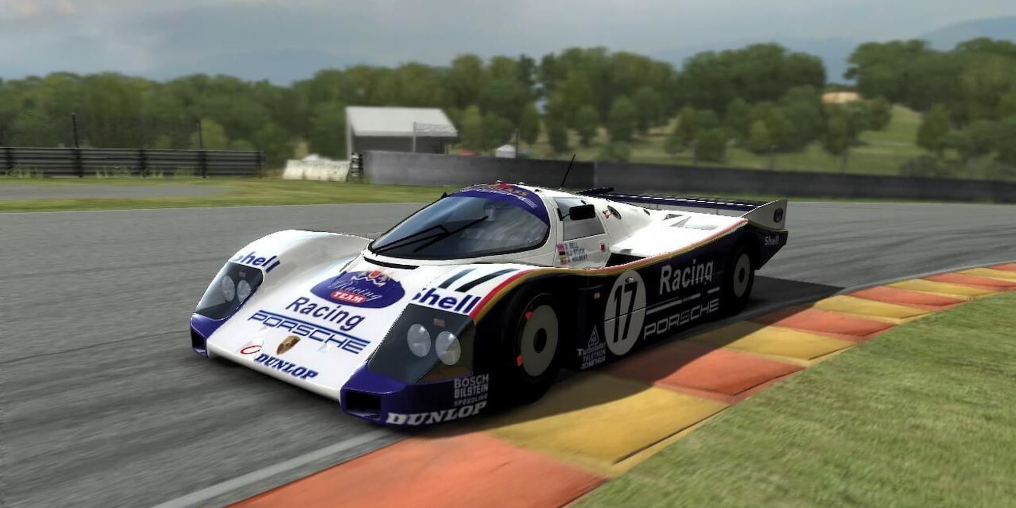 A white Porsche racing vehicle takes a curve on a track in Forza Motorsport 2.