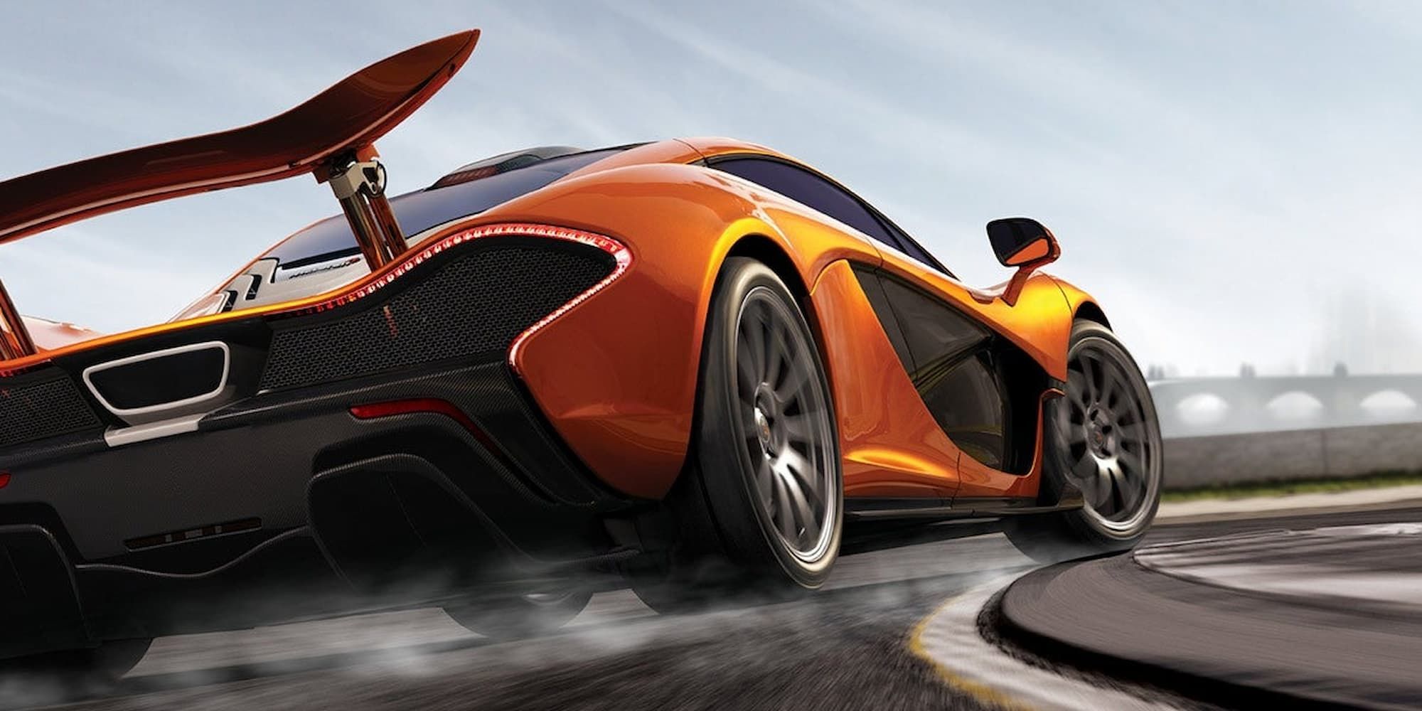 An orange car sends smoke from under its tires as it takes a turn in Forza Motorsport 5.