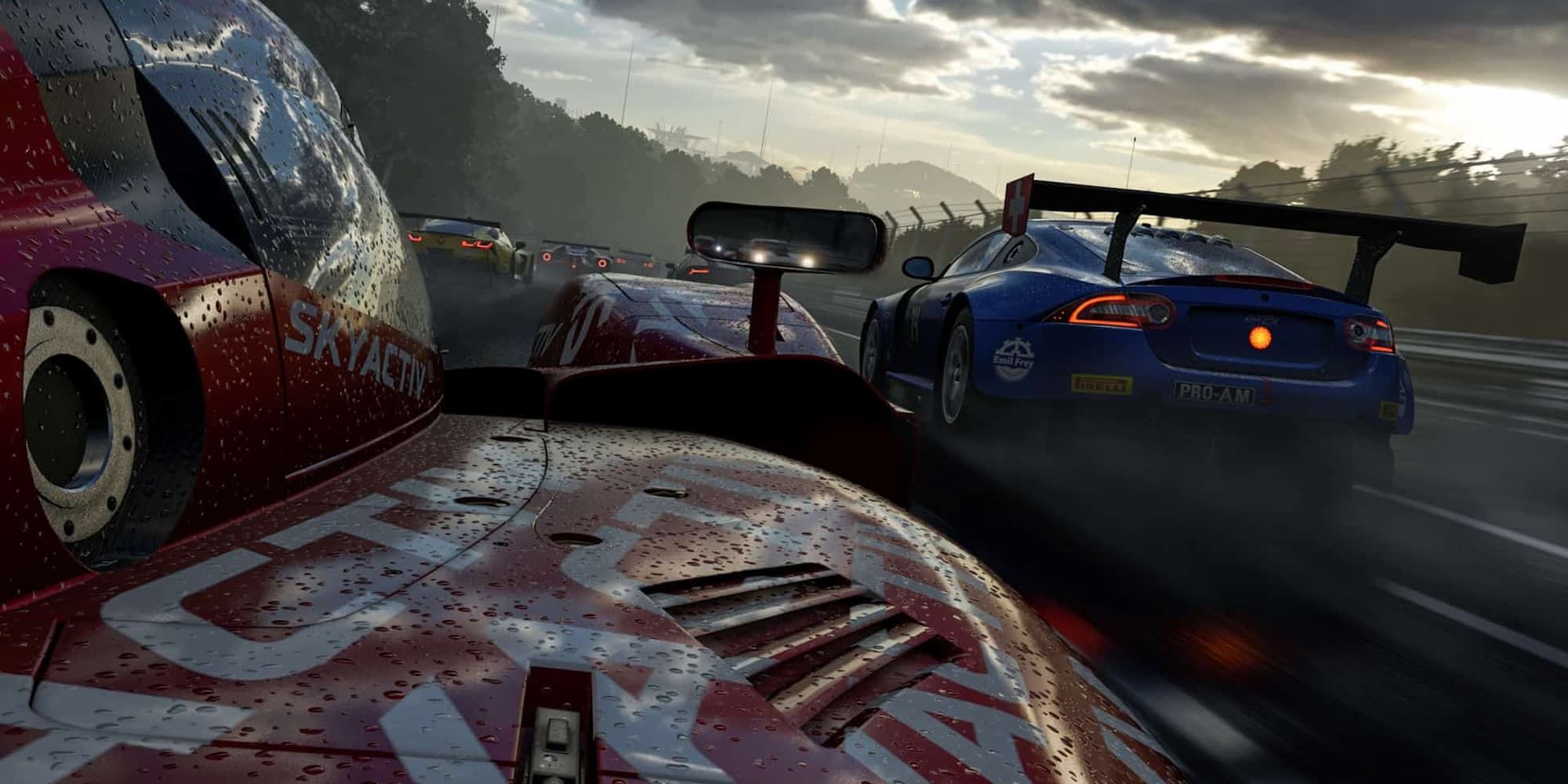 The perspective from the side of a red car is shown as it tries to catch up to other vehicles in rainy weather in Forza Motorsport 7.