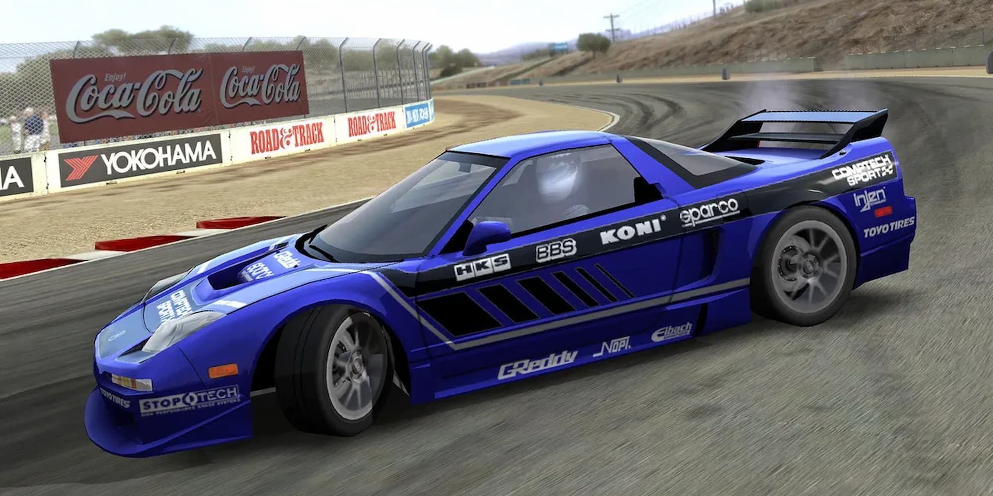 A blue racecar drifts around a turn in the original Forza Motorsport.