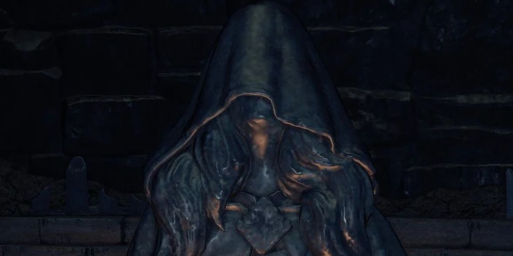 A Velka Statue buried underground in Dark Souls 3 the video game