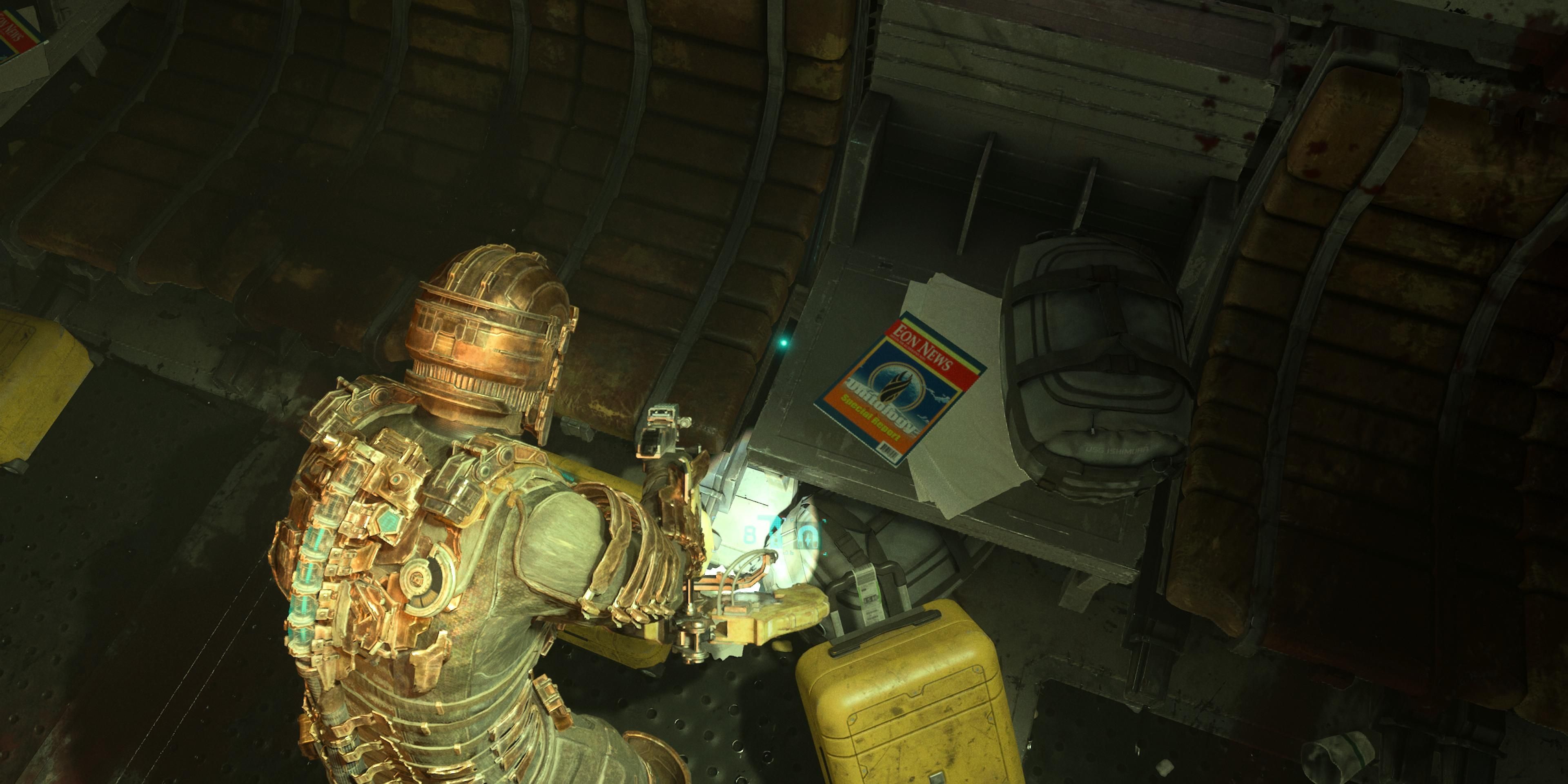 Isaac looking at a magazine at the tram station in Dead Space