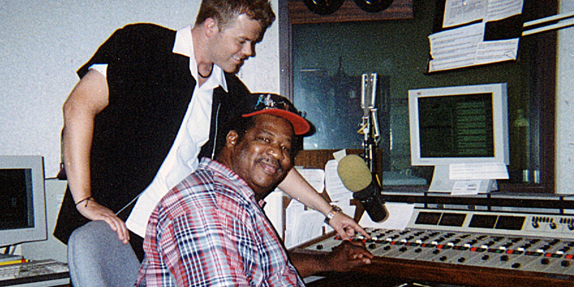 Jerry Lawson sitting in front of a microphone