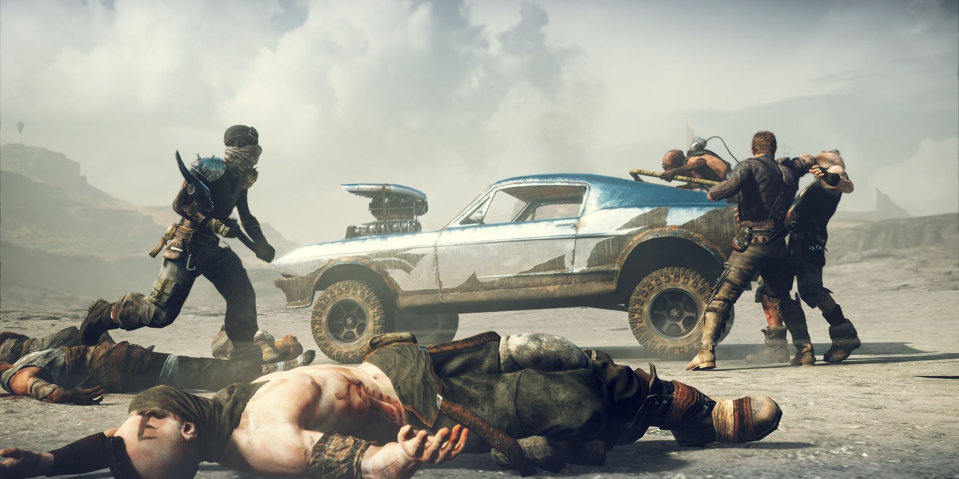 Max fighting bandits next to his car in Mad Max