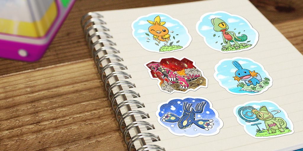 Six different Pokemon Go Tour-themed Stickers on the page of a notebook