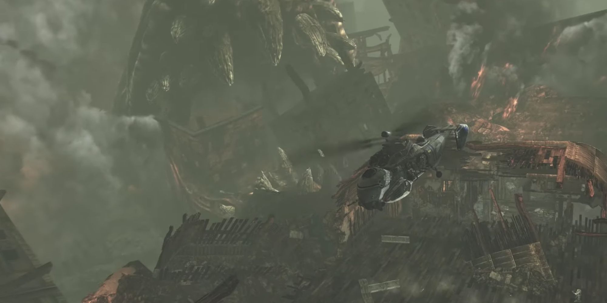 Riftworm tearing through buildings and about to engulf Delta Squad in a helicopter in Gears of War 2