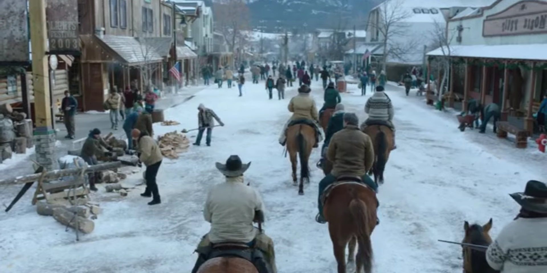 A shot of Joel and Ellie on horseback entering the snow-filled town square of Jackson, Wyoming to meet Tommy.
