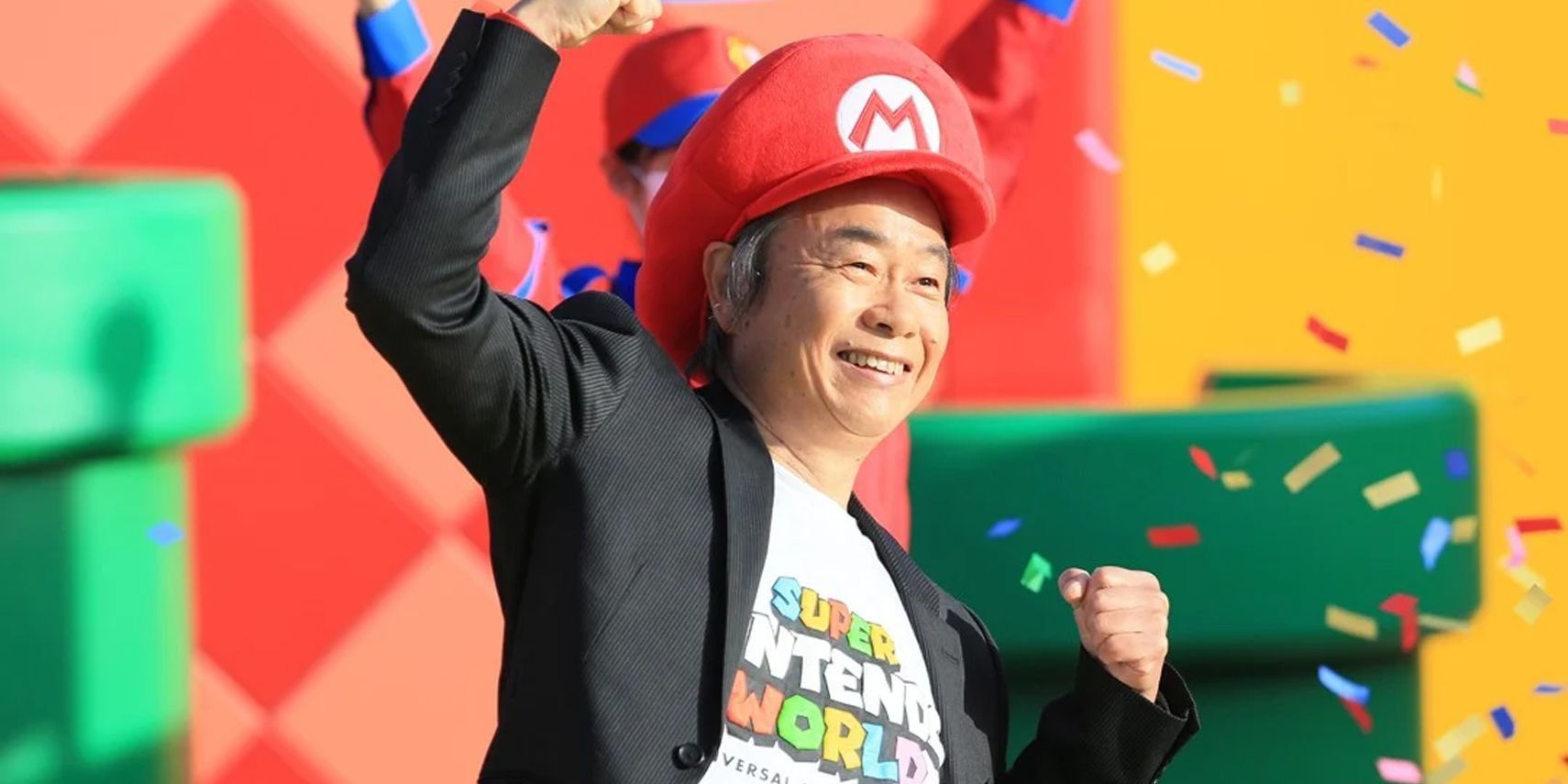 Shigeru Miyamoto at Super Nintendo World in a Mario hat