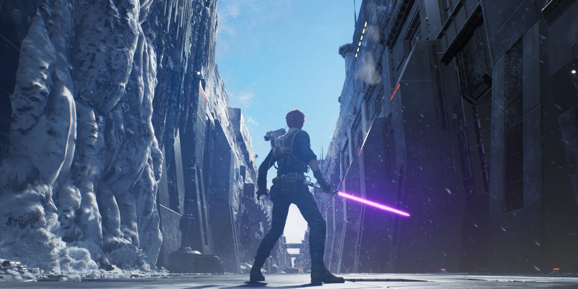 Cal standing in a snowy landscape with his lightsaber out in Star Wars Jedi - Fallen Order.