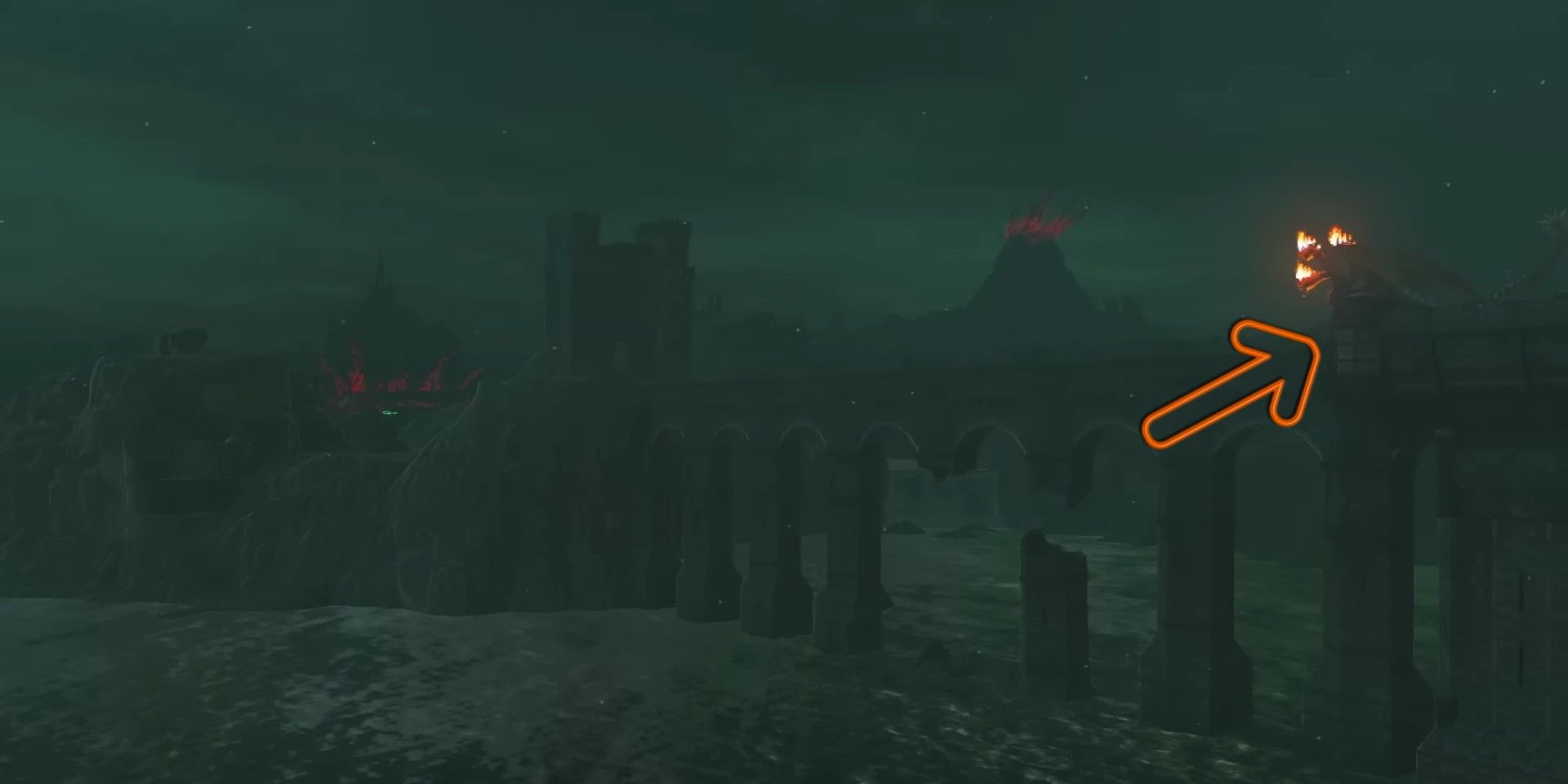 Tears of the Kingdom screenshot showing an orange arrow pointing toward a three-headed dragon on the Bridge of Hylia