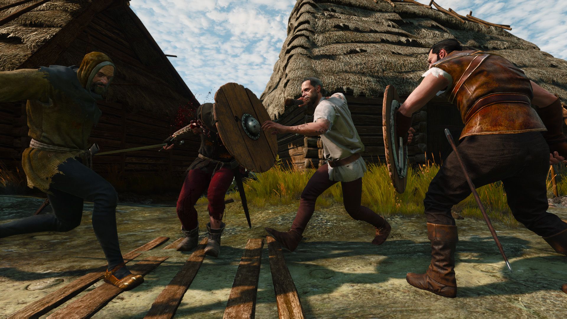 Two groups of poorly dressed peasants charge at each other on a sunny day at a pillaged village.