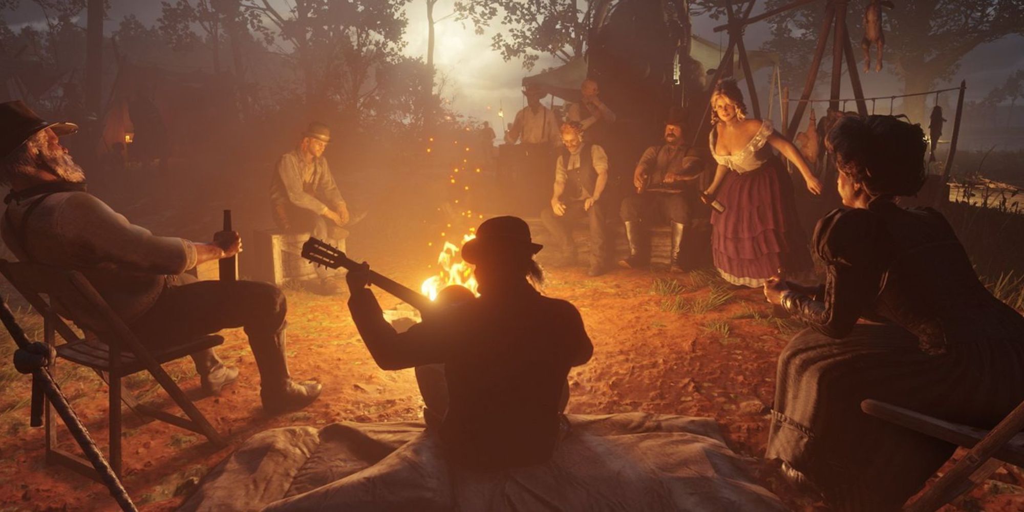 Various members of the Van der Linde gang around the campfire in Red Dead Redemption 2
