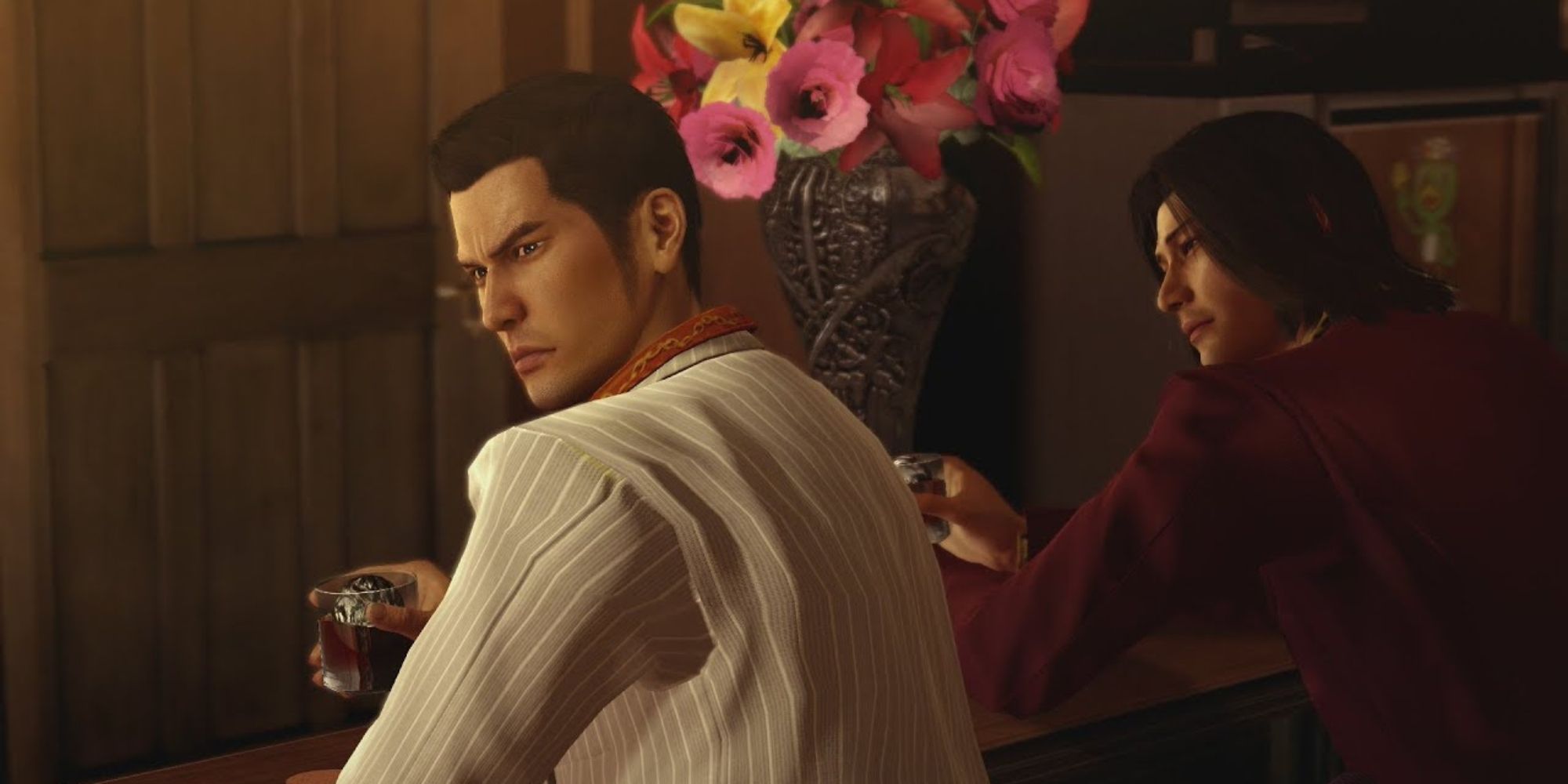 Yakuza 0 Screenshot of Kiryu and Niki drinking at Serena's place