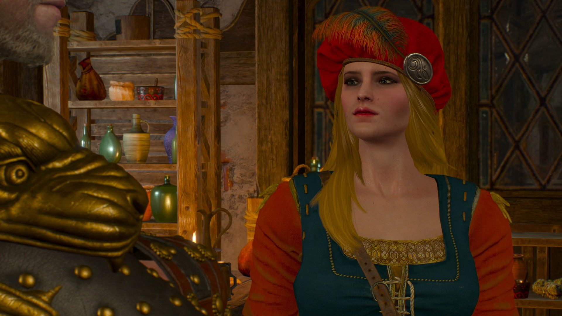 Priscilla, wearing her usual red and blue outfit, gives a worried expression while speaking to Geralt 