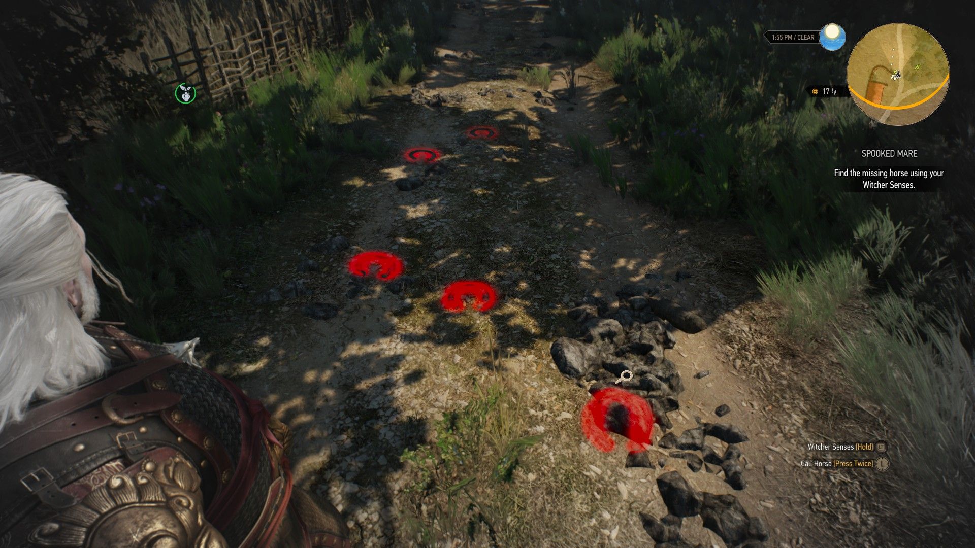 Geralt&rsquo;s Witcher Senses highlight a set of hoofprints in a dirt road in the countryside.