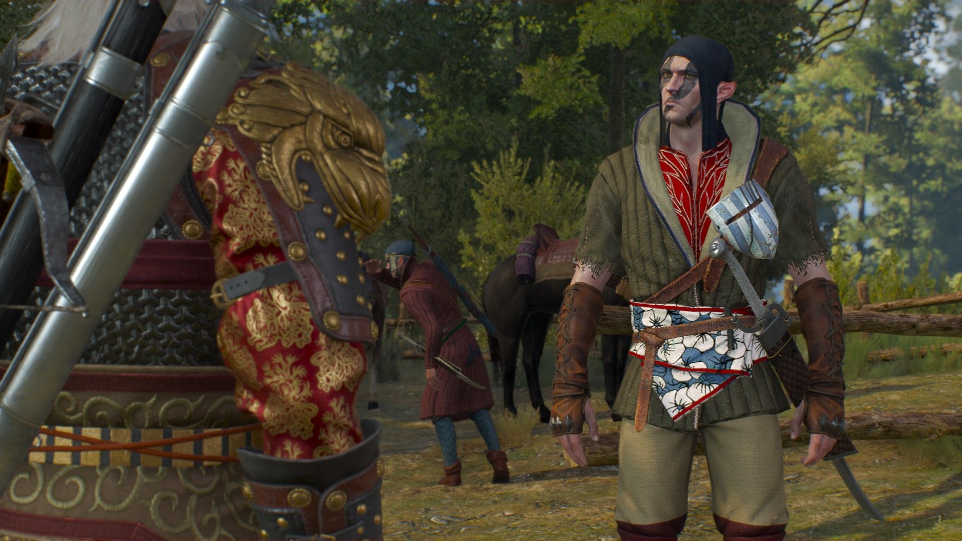 An elven man wearing light armor with a sword on his hip regards Geralt with caution by a stable in the woods.