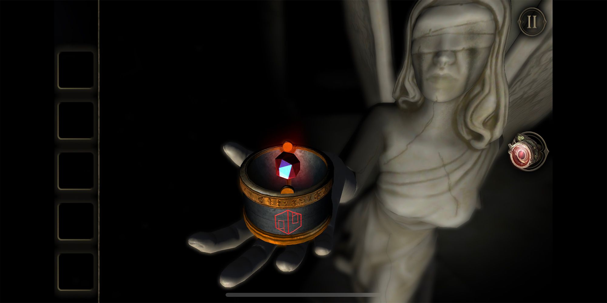 A statue of an angel holds a red stone in a container marked by a rune in The Room Two+.