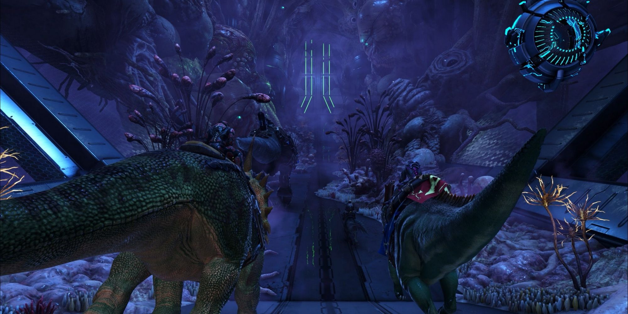 Two players mounted on dinosaurs walk down a metal path surrounded by foilage 