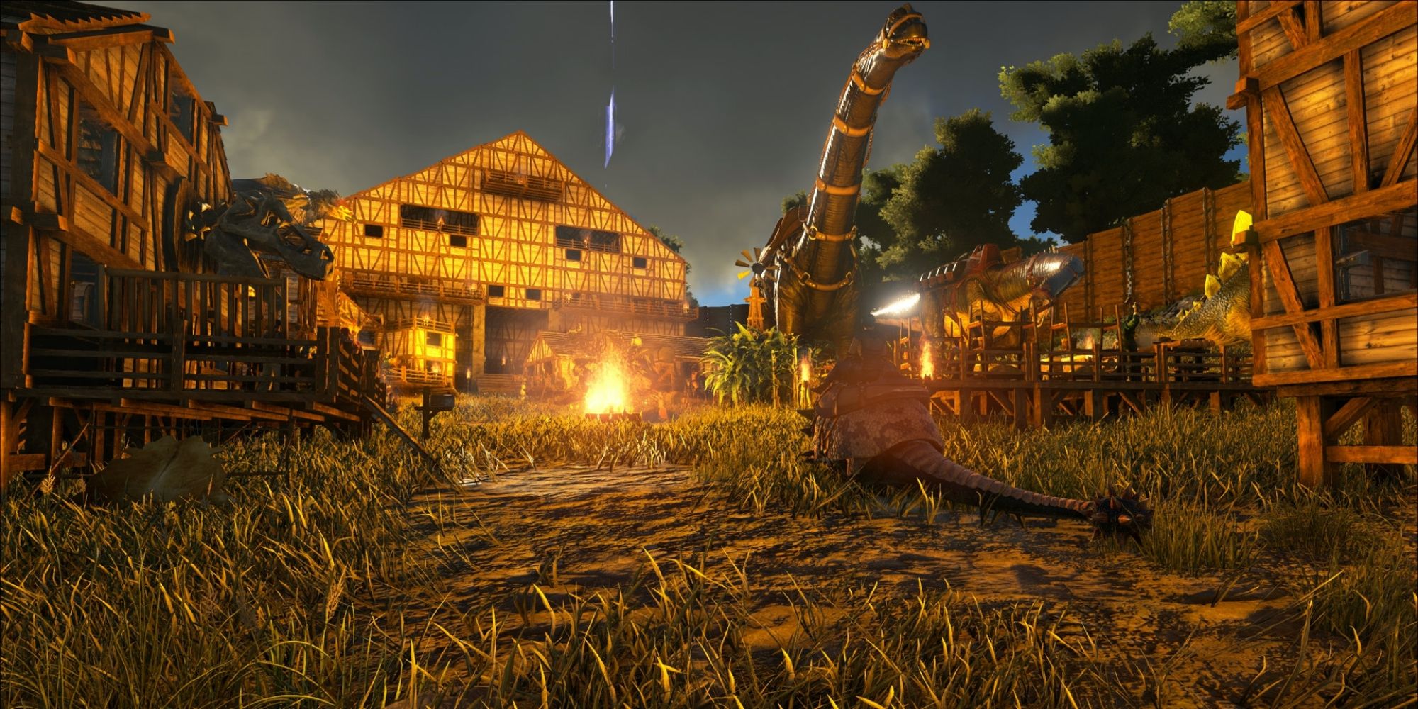 Several player buildings in an older style along with a few tamed dinosaurs