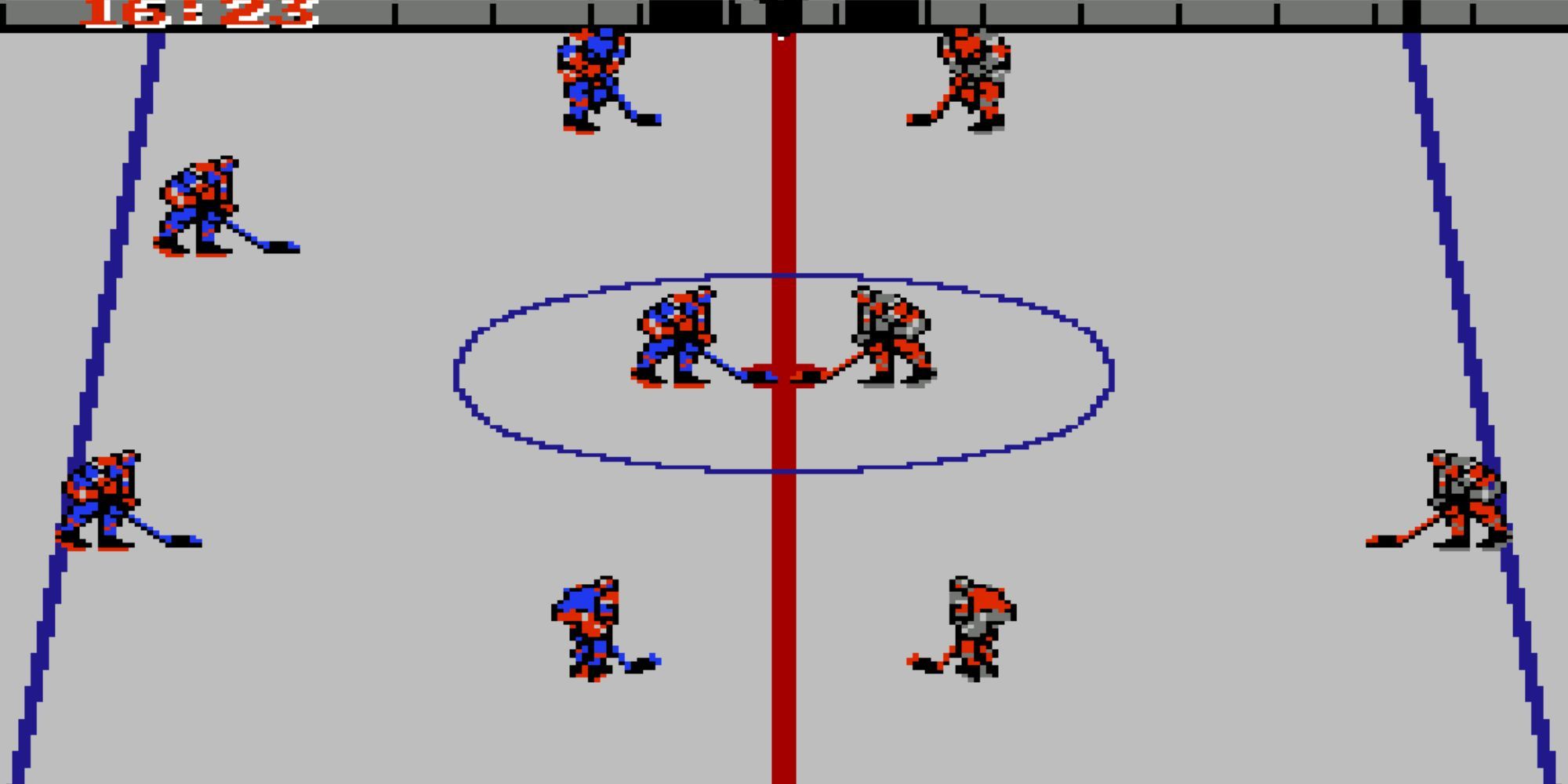 Two hockey teams face-off in the middle of the rink