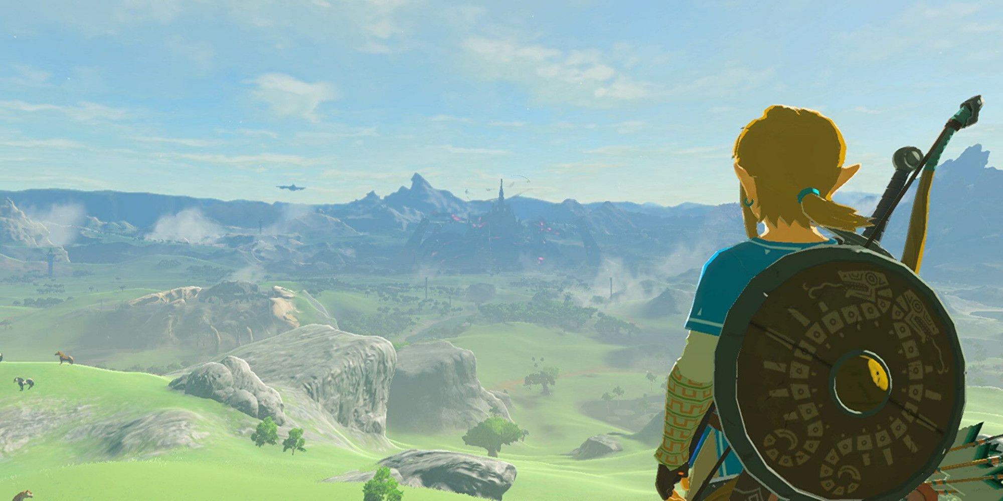 Breath of the Wild Link looking at Hyrule Castle in the distance