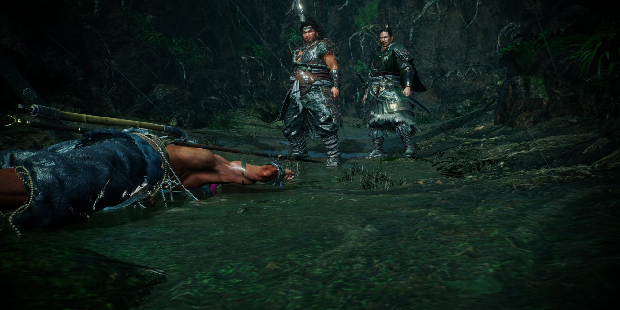 The protagonist playing dead at the feet of two companions - Wo Long