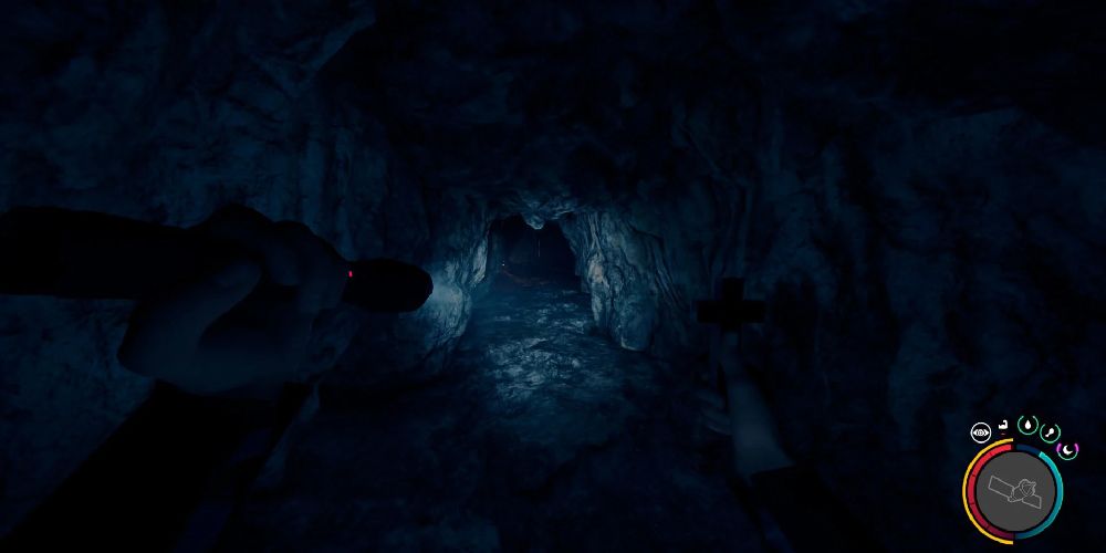 character using flashlight to light up cave in sons of the forest