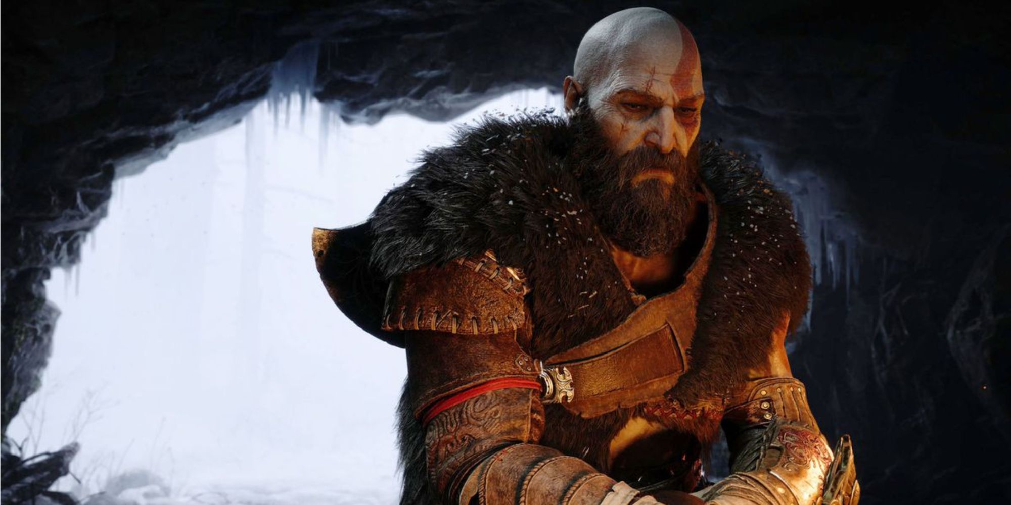 kratos sat by the fire in god of war ragnarok