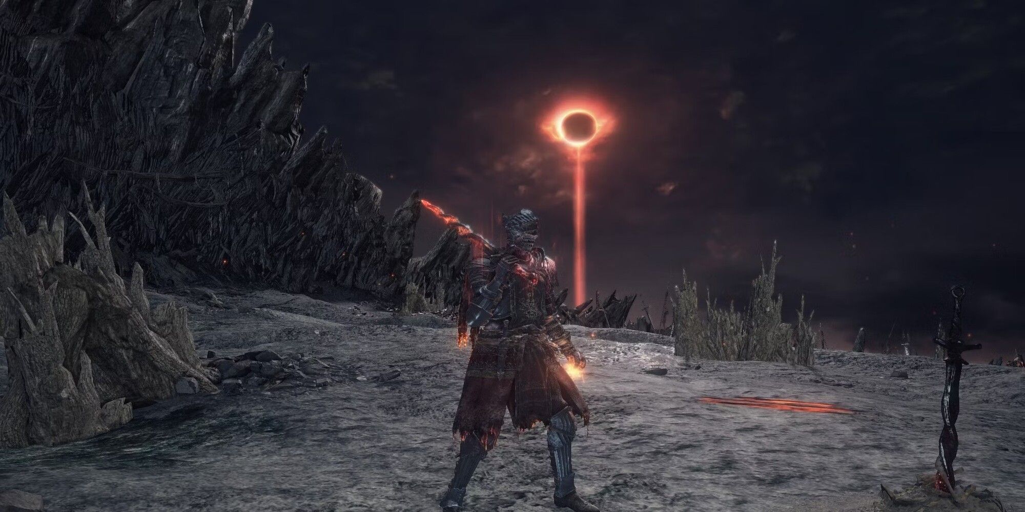 The player grabbing the unique Greatsword in a deserted line where an eclipse is taking place in Dark Souls 3