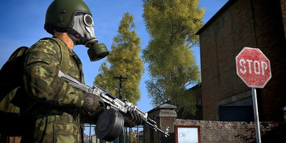 dayz person in gas mask and military fatigues holding assault rifle