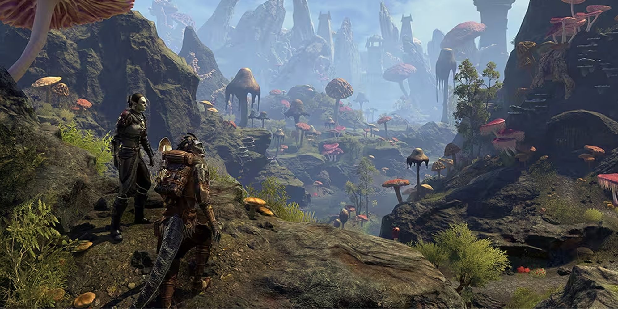 Elder Scrolls Online adventurers standing on a cliff overlooking a Morrowind valley full of giant mushrooms
