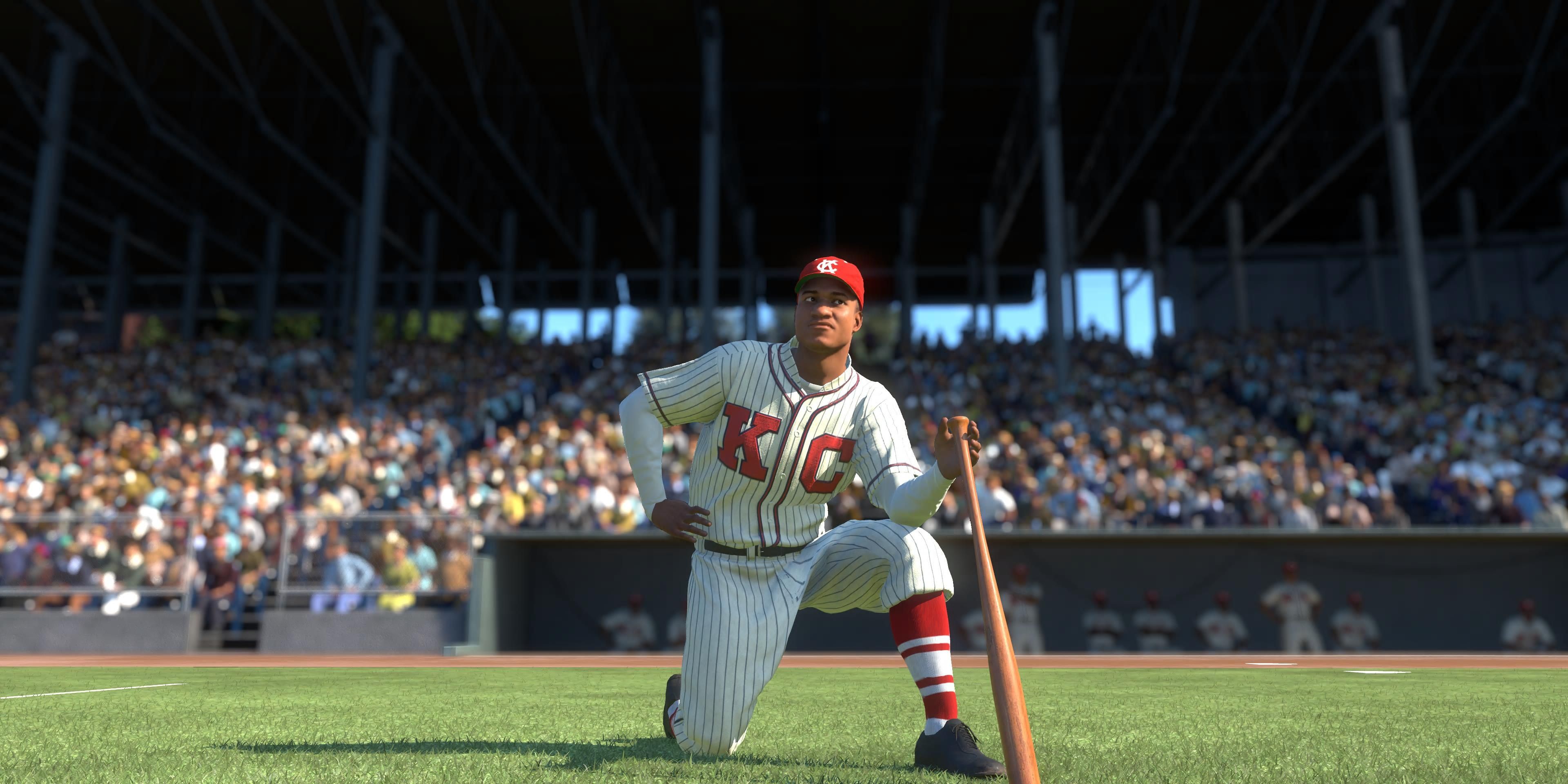 Hank Thompson kneeling on the side with bat