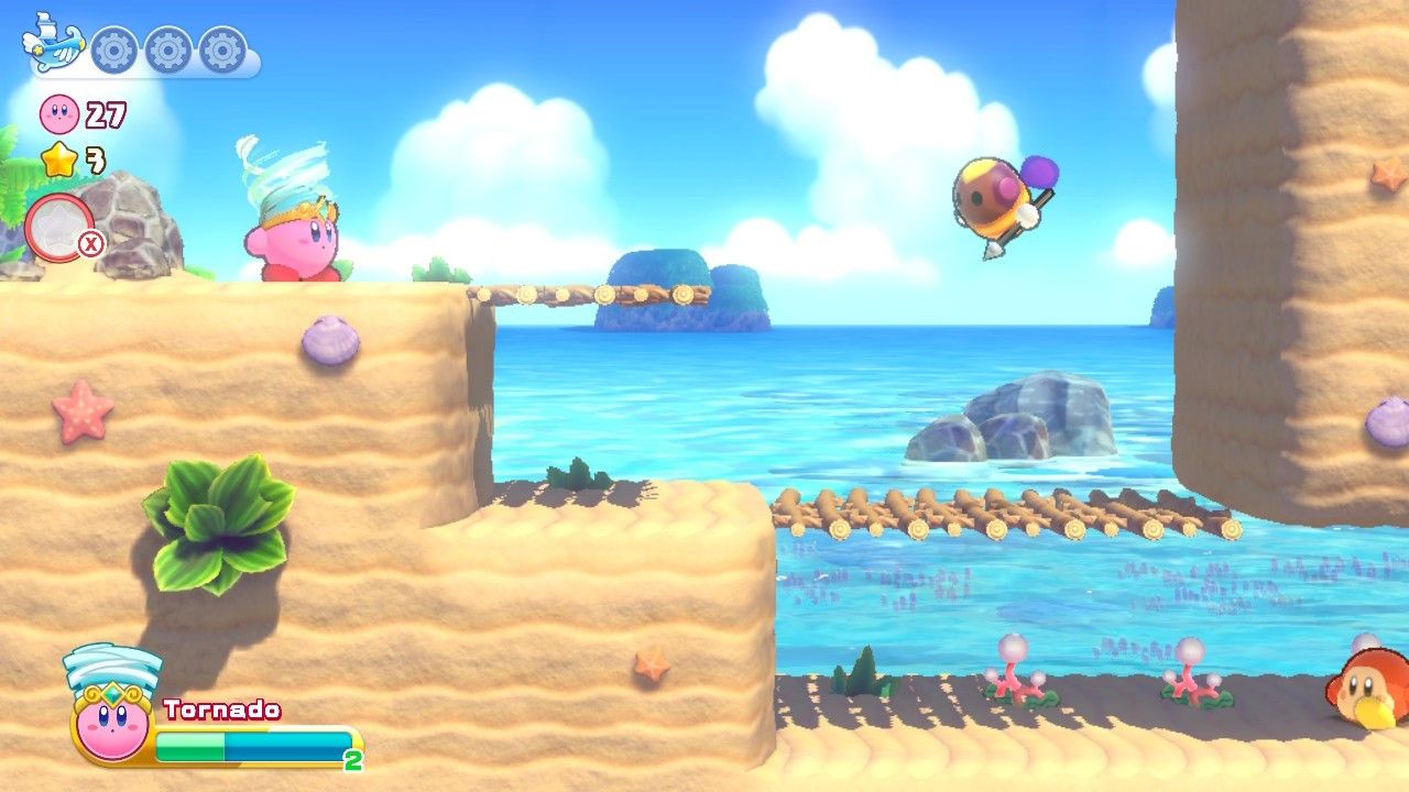 Kirby Onion Ocean Stage One Fourth Section - пчелиный враг летит впереди, а Waddle Dee находится внизу.