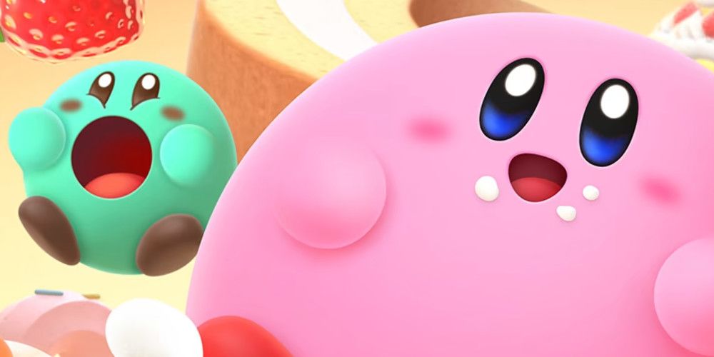 Kirbys Dream Buffet Cover Zoomed in On Pink Kirby and Green Kirby, Both Chubby