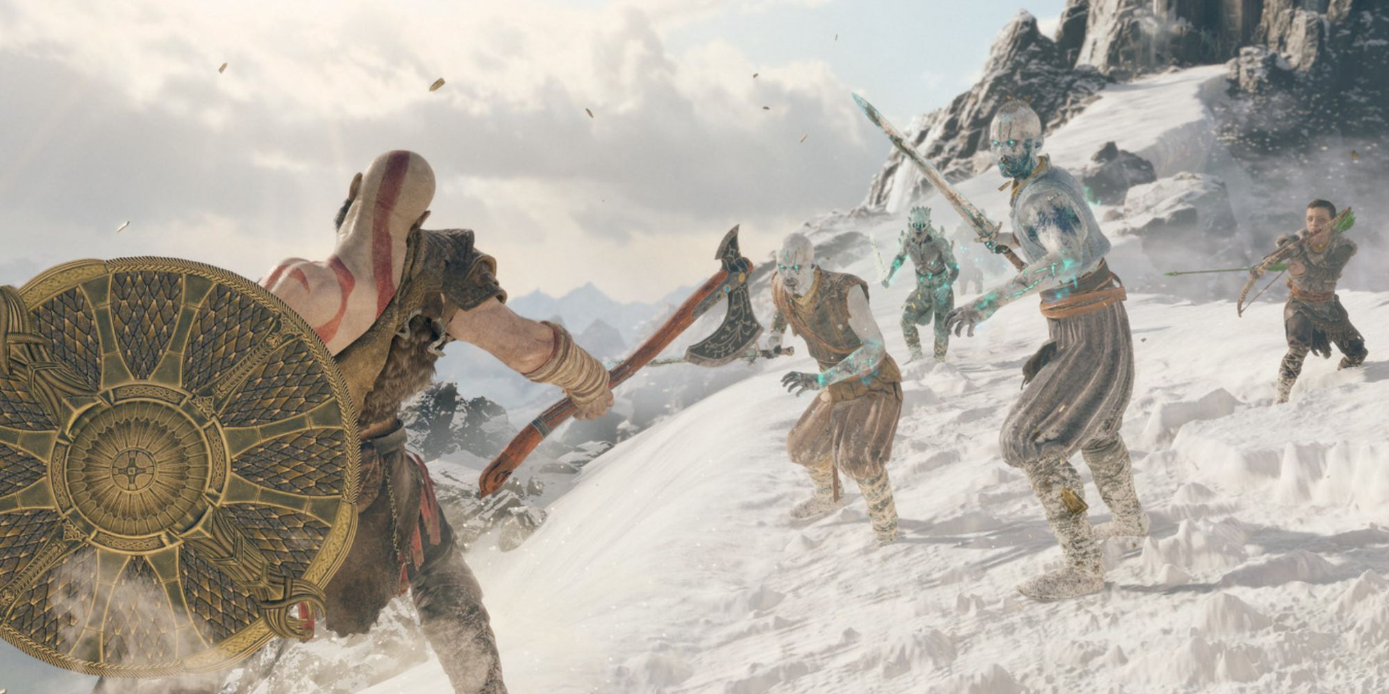 Kratos and Atreus fighting enemies on top of a snowy mountain in God of War