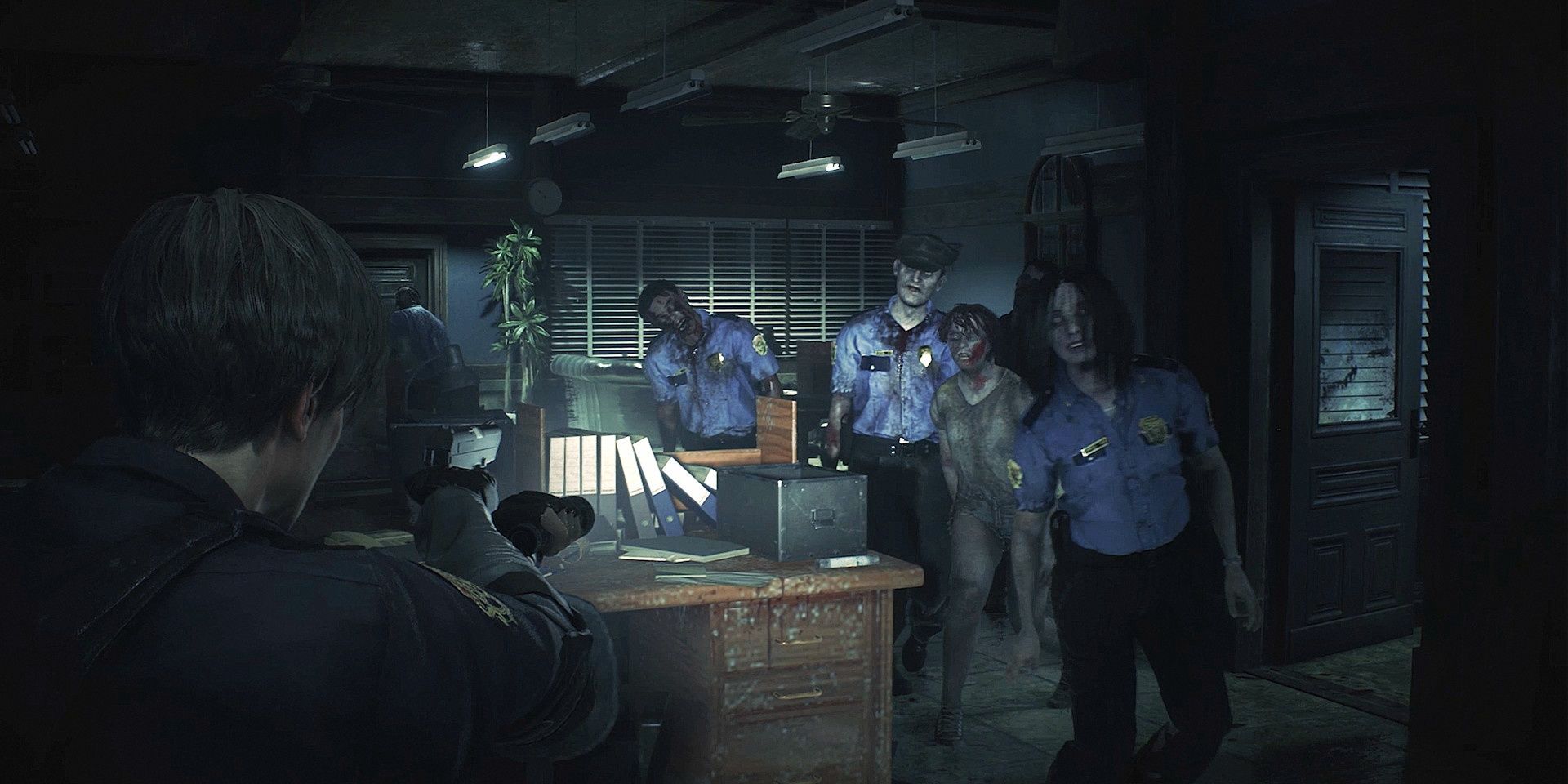 Leon aiming his gun at a group of zombies in Resident Evil 2 Remake