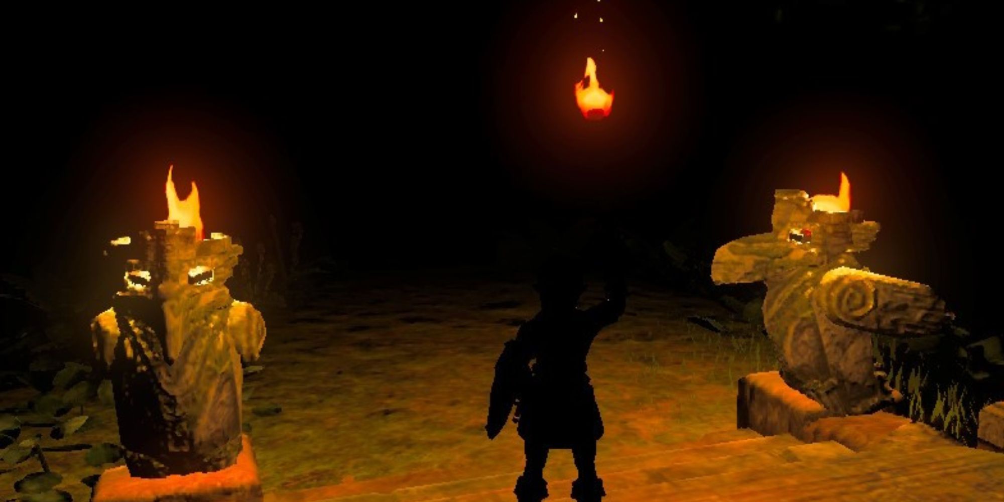 Link holding a torch in the dark in Thyphlo Ruins in BOTW