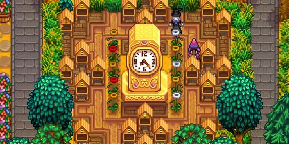 The golden clock in a lush green garden in Sardew Valley the video game