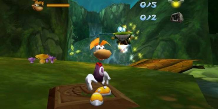 Rayman stands by a bridge while Murfy hovers over his shoulder in Rayman 2.