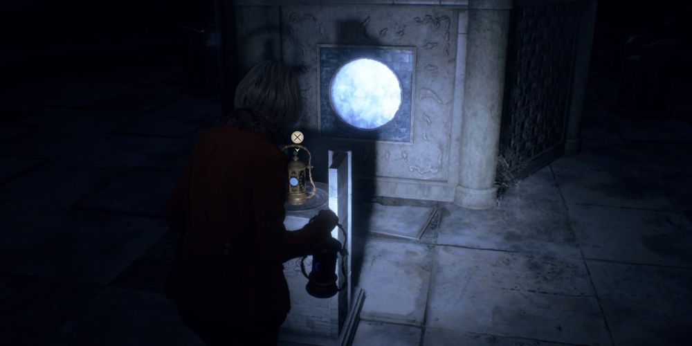 Ashley Graham rearranges the blue lanterns in Resident Evil 4 Remake