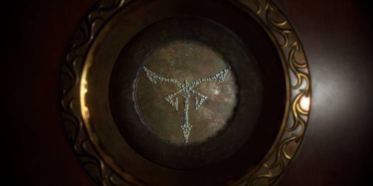 the crystal marble in resident evil 4 remake, configured to display the los illuminados cult emblem