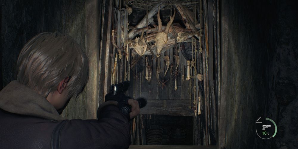 leon kennedy approaches the stairs to the hunter's lodge basement in resident evil 4 remake