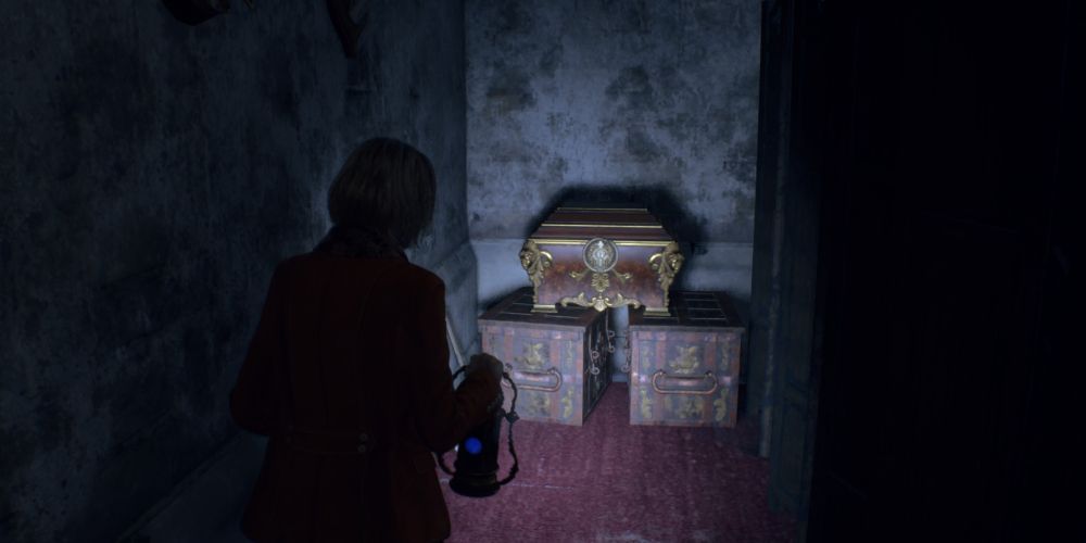 ashley graham finds a treasure chest in the mausoleum in resident evil 4 remake