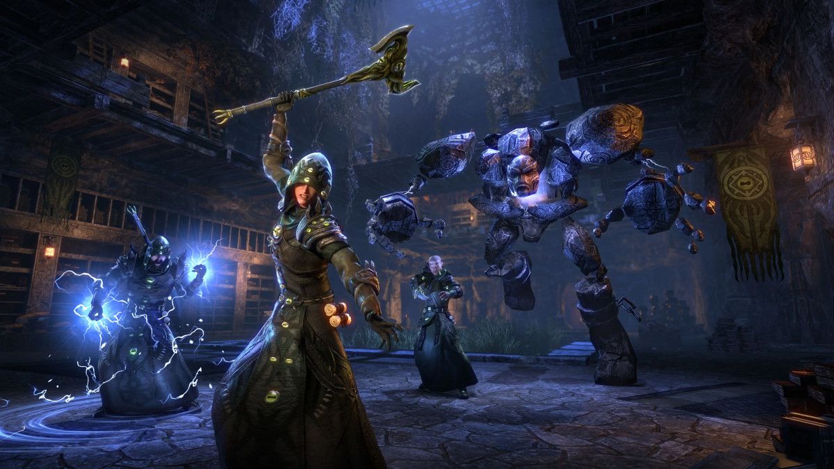 ESO player swinging an ax next to an angry mage and a storm atronach in a cave fortress