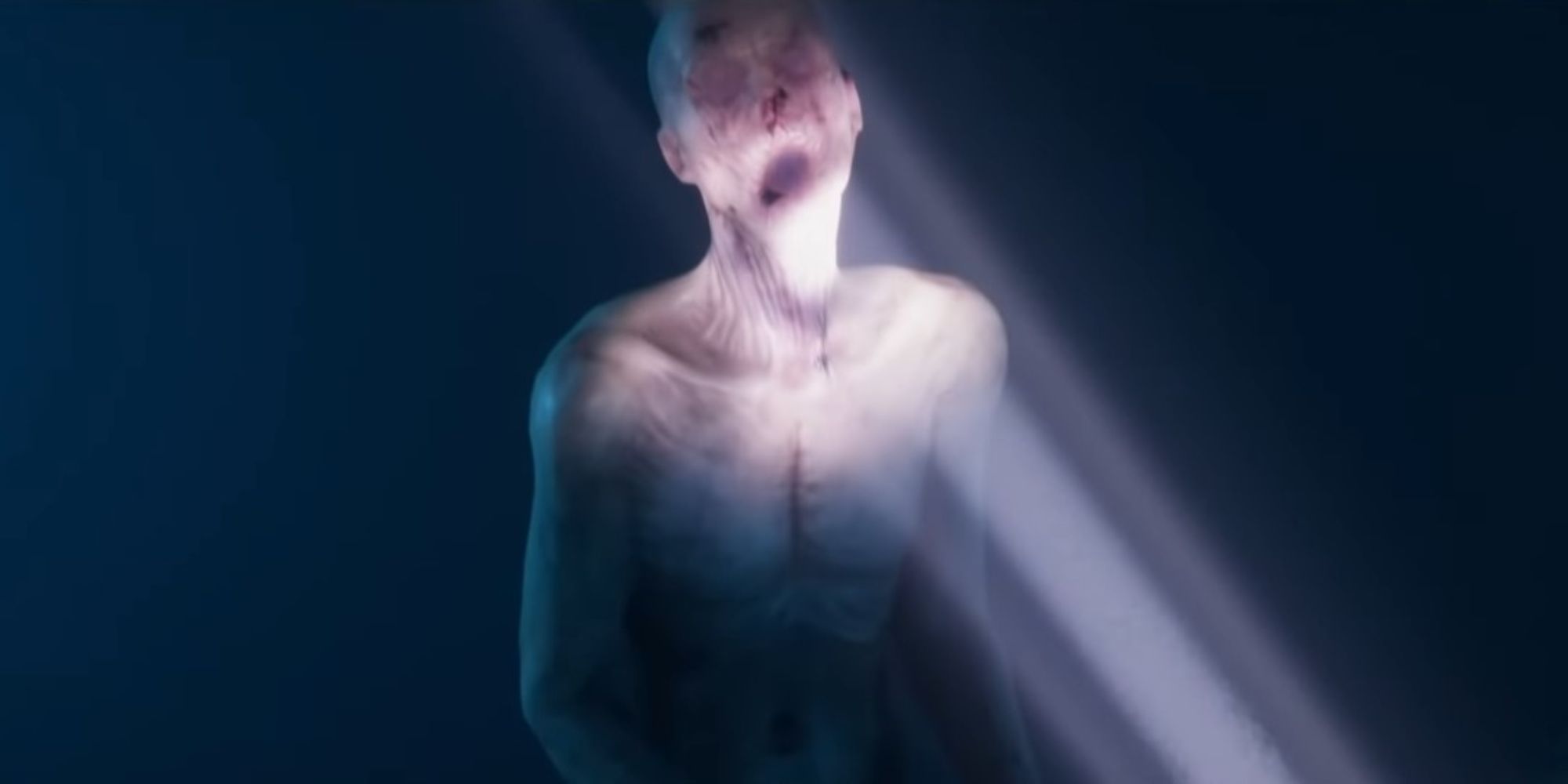 An image of a blind mutant from Sons of the Forest with a flashlight shining in its face.