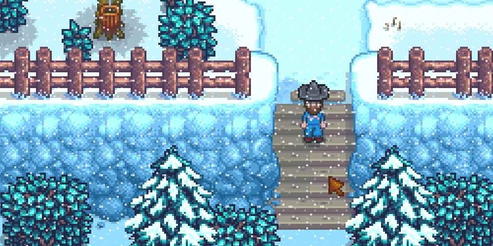 A backwoods trail shortcut during winter in Stardew Valley the video game